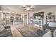 Open living area featuring a fireplace, TV, and seamless flow into the kitchen with island seating at 4442 Solitude Falls Ave, North Las Vegas, NV 89084