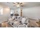 Upstairs loft area with couch, carpet, and natural light creates a cozy and inviting space at 4442 Solitude Falls Ave, North Las Vegas, NV 89084