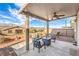Relaxing outdoor patio featuring patio furniture and string lights at 4442 Solitude Falls Ave, North Las Vegas, NV 89084