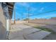 Spacious backyard featuring a patio area, block wall fence, and potential for landscaping at 4629 Alta Dr, Las Vegas, NV 89107
