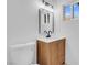 Bathroom featuring a modern vanity with a stylish faucet and a framed mirror with lighting at 4629 Alta Dr, Las Vegas, NV 89107