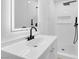 Modern bathroom with a vanity, shower and white subway tile at 4629 Alta Dr, Las Vegas, NV 89107