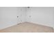 Bedroom featuring neutral carpet, white walls, and 2 entry doors at 4629 Alta Dr, Las Vegas, NV 89107