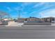 Charming single-story home with a two car garage and well-maintained front yard under a blue sky at 4629 Alta Dr, Las Vegas, NV 89107