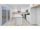 Modern kitchen with stainless steel appliances, an island, and sliding glass doors at 4629 Alta Dr, Las Vegas, NV 89107
