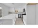 Modern kitchen with stainless steel appliances, an island, and sliding glass doors at 4629 Alta Dr, Las Vegas, NV 89107