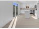 Modern kitchen with stainless steel appliances, an island, and sliding glass doors at 4629 Alta Dr, Las Vegas, NV 89107