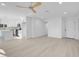 Open-concept layout showcasing the bright living room and updated kitchen with new floors at 4629 Alta Dr, Las Vegas, NV 89107