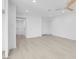 Bright living room featuring light wood floors, multiple entryways, and recessed lighting at 4629 Alta Dr, Las Vegas, NV 89107