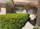 Inviting entrance with manicured shrubs and a concrete walkway leading to a bright front door at 5041 Mount Pleasant Ln, Las Vegas, NV 89113
