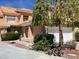 Charming home with a two-car garage, featuring a lovely red tile roof and well-maintained landscaping at 5041 Mount Pleasant Ln, Las Vegas, NV 89113