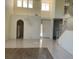 Bright foyer with tile floors, staircase, chandelier, and high ceilings creating an open and welcoming space at 5041 Mount Pleasant Ln, Las Vegas, NV 89113