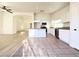 Modern kitchen with stainless steel appliances, an island, and seamless flow to living space at 5829 Aqua Verde St, North Las Vegas, NV 89031