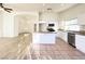 Well-lit kitchen features stainless steel appliances, an island, and tile flooring at 5829 Aqua Verde St, North Las Vegas, NV 89031