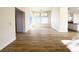 Open living room with wood flooring and windows offering plenty of natural light at 5829 Aqua Verde St, North Las Vegas, NV 89031