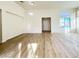 Bright living room boasts wood flooring and a neutral color palette at 5829 Aqua Verde St, North Las Vegas, NV 89031