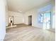 Spacious living room boasts wood flooring, natural light, and a neutral color palette at 5829 Aqua Verde St, North Las Vegas, NV 89031