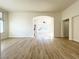 Bright, open living area features hardwood floors and arched doorways to connecting rooms at 5829 Aqua Verde St, North Las Vegas, NV 89031