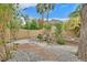 Picturesque backyard featuring a charming waterfall and lush landscaping, creating a tranquil oasis at 5835 Farmhouse Ct, Las Vegas, NV 89141