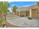 Well-maintained backyard featuring a spa and covered patio ideal for outdoor gatherings and relaxation at 5835 Farmhouse Ct, Las Vegas, NV 89141