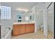 Bright bathroom featuring double sinks, tub, and a separate toilet area at 5835 Farmhouse Ct, Las Vegas, NV 89141