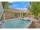 Relaxing hot tub on a patio, complemented by an overhead pergola and lush landscaping at 5835 Farmhouse Ct, Las Vegas, NV 89141
