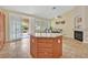 Kitchen island featuring tile flooring and sliding glass doors to backyard at 5835 Farmhouse Ct, Las Vegas, NV 89141