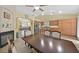 Open kitchen and dining area with tile floors and views of the fireplace at 5835 Farmhouse Ct, Las Vegas, NV 89141