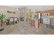 Eat in kitchen with tile flooring, stainless steel appliances, and breakfast bar at 5835 Farmhouse Ct, Las Vegas, NV 89141