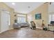 Bright living room with tile flooring, neutral walls, and plenty of natural light at 5835 Farmhouse Ct, Las Vegas, NV 89141