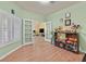 Bright office space with hardwood floors, natural light and french door entry to living room at 5835 Farmhouse Ct, Las Vegas, NV 89141