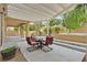 Inviting patio space with a pergola, dining set, and adjacent hot tub, ideal for outdoor living at 5835 Farmhouse Ct, Las Vegas, NV 89141