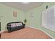 Comfortable sitting room with hardwood floors, neutral walls, and window shutters at 5835 Farmhouse Ct, Las Vegas, NV 89141