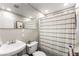 Clean bathroom featuring a pedestal sink, toilet, and shower with a striped curtain at 6121 Dayton Cir, Las Vegas, NV 89107