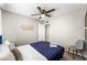 Bedroom features modern décor, ceiling fan and grey chair at 6121 Dayton Cir, Las Vegas, NV 89107