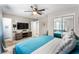 Spacious bedroom features TV, modern decor and a mirrored closet at 6121 Dayton Cir, Las Vegas, NV 89107