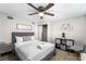 Stylish bedroom with a ceiling fan, sliding closet doors, and tasteful decor at 6121 Dayton Cir, Las Vegas, NV 89107