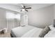 Serene bedroom with large window, providing ample natural light and a comfortable bed at 6121 Dayton Cir, Las Vegas, NV 89107
