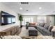 Inviting living area featuring hardwood flooring, bay window, and contemporary furnishings at 6121 Dayton Cir, Las Vegas, NV 89107