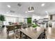 Open-concept layout with kitchen, dining, and living areas in a modern design at 6121 Dayton Cir, Las Vegas, NV 89107