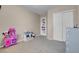 Cozy bedroom with gray carpet, toy storage, and closet for organizing belongings in an orderly way at 6461 Karlsen Ct, Las Vegas, NV 89122