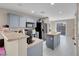 Open kitchen design with stainless steel appliances and a gray island perfect for entertaining at 6461 Karlsen Ct, Las Vegas, NV 89122