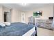 Comfortable main bedroom with a dresser, TV and carpet at 6461 Karlsen Ct, Las Vegas, NV 89122
