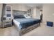 Comfortable main bedroom with a plush bed, side tables and neutral wall and flooring at 6461 Karlsen Ct, Las Vegas, NV 89122