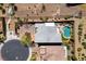 Aerial rooftop view of a private backyard oasis featuring a pool, spa, lounge area and lush landscaping at 6491 Wild Blue Ct, Las Vegas, NV 89135