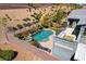 Backyard oasis featuring a pool, spa, patio, outdoor kitchen, and privacy walls at 6491 Wild Blue Ct, Las Vegas, NV 89135