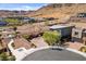 Modern home featuring a two-car garage in a desert community with beautiful views of the mountains at 6491 Wild Blue Ct, Las Vegas, NV 89135