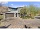 Charming two-story home with a three-car garage and a beautiful brick driveway at 6491 Wild Blue Ct, Las Vegas, NV 89135