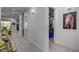 Hallway featuring hardwood floors, neutral wall paint and open access to other rooms at 6491 Wild Blue Ct, Las Vegas, NV 89135