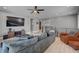 Spacious living room featuring hardwood floors, recessed lighting, and comfortable seating, perfect for relaxation and entertainment at 6491 Wild Blue Ct, Las Vegas, NV 89135